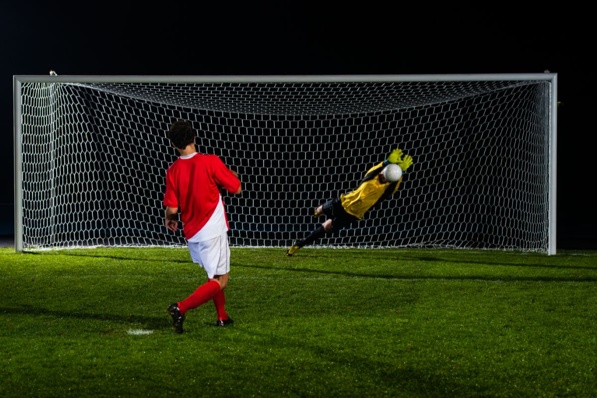 Choosing A Goal Frame - player shooting goalie saves his shot