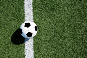 Soccer ball crossing the goal line. What Does Relegation Mean In Soccer