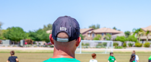 coach wearing a cap in soccer