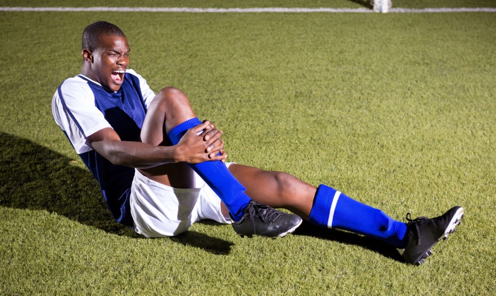 soccer player kicked in shins - how to wear shin guards